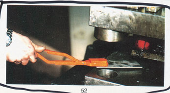 Plam Magnet being used to take of hot object from the oven